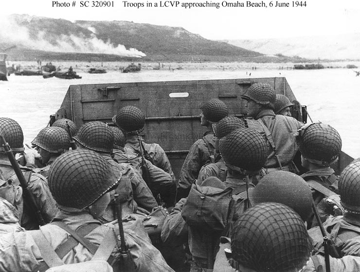 Troops in an LCVP landing craft approaching "Omaha" Beach on "D-Day", 6 June 1944.Photograph from the Army Signal Corps Collection in the U.S. National Archives.