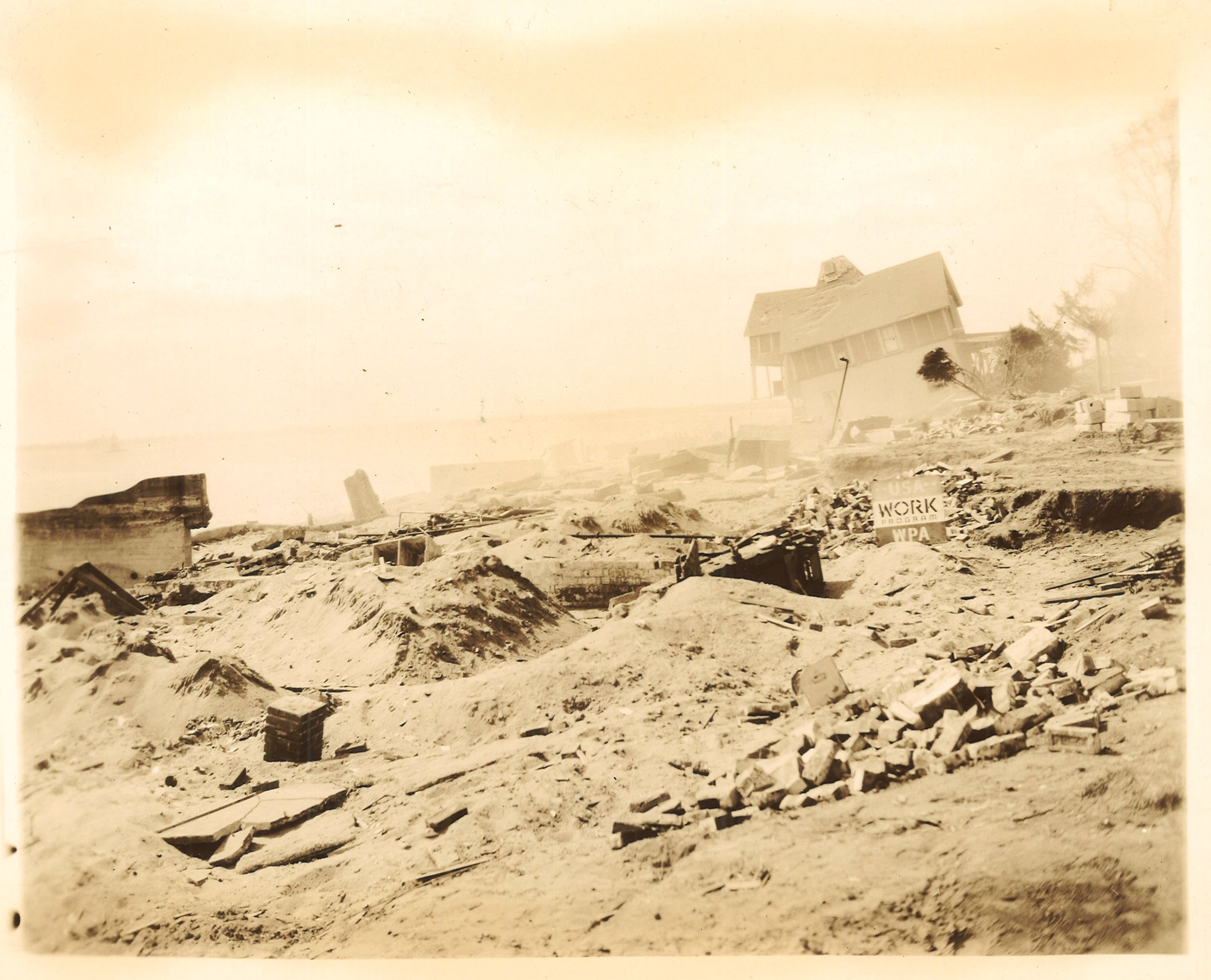 Southeast corner of Narragansett Terrace. Lower left of picture sifted sand showing after workers had looked for valuables on land of Dr. Cabana of Central Falls whose home was completely demolished. (Lot 276) 1992.61.17