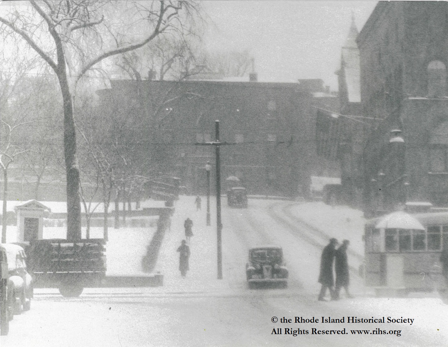 Estey, Charlotte (photographer). [ View up Waterman Avenue from North Main Street in the snow]. Providence, Rhode Island. 1945-1955. Photograph: Silver gelatin. Mary Elizabeth Robinson Research Center, G Lot 144, Charlotte Estey Collection.